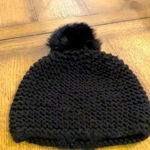 Trendy black toque with pompon